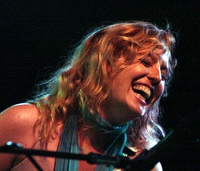 Tift Merritt performing on October 9, 2005 at the Shakori Hills Grassroots Festival, North Carolina. Photograph taken by Forrest L. Smith, III (a.k.a. Filbert Hockey), at the Shakori Hills Music Festival, Chatham County, N.C., October 9, 2005.